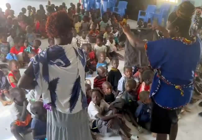 Giving out clothes to the kids in Our School